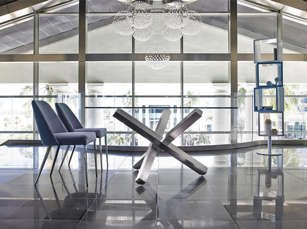 Dining table with polished steel base
