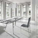 Extendable dining table in tempered glass and chromed steel