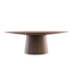 Oval dining table in walnut veneered wood.