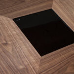 Walnut wood dining table with black tinted glass