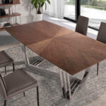 Dining table in walnut wood and chrome-plated steel