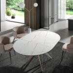 Round porcelain marble and champagne-coloured steel extending dining table