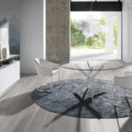 Round dining table in tempered glass and white stainless steel