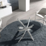 Round dining table in tempered glass and white stainless steel