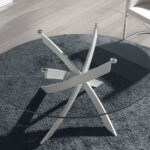 Round dining table in tempered glass and white stainless steel