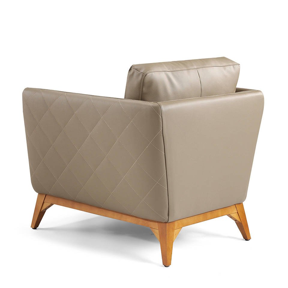 Armchair upholstered in leather and Walnut wood legs Armchair upholstered in leather and Walnut wood legs