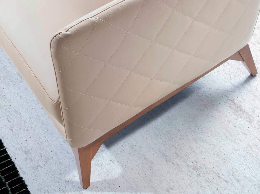Armchair upholstered in leather and Walnut wood legs Armchair upholstered in leather and Walnut wood legs
