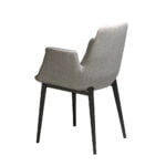 Chair upholstered in fabric with black steel frame