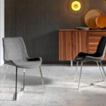 Chair upholstered in fabric with chrome steel legs