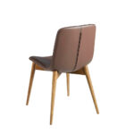 Chair upholstered in leatherette with solid wood legs in Walnut color