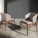 Chair upholstered in leatherette with Walnut colored wooden structure