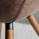 Chair upholstered in leatherette with solid wood legs in Walnut color