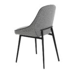 Chair upholstered in fabric with piping and black steel frame