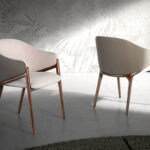 Chair upholstered in fabric and leatherette with Walnut colored wooden frame