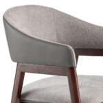 Chair upholstered in fabric and leatherette with Walnut colored wooden frame