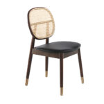 Chair upholstered in leatherette with rattan backrest and walnut wood legs
