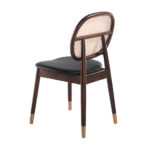 Chair upholstered in leatherette with rattan backrest and walnut wood legs