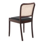 Chair upholstered in leatherette with rattan backrest and Walnut wood legs