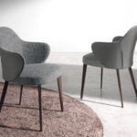 Upholstered fabric and leatherette chair with dark brown steel structure