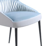 Dining chair upholstered in velvet and eco-leather. Black steel structure.