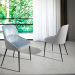 Dining chair upholstered in velvet and eco-leather. Black steel structure.