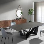 Dining chair upholstered in velvet and eco-leather. Black steel structure.