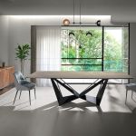 Dining chair upholstered in velvet and eco-leather. Black steel structure.