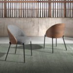 Dining chair upholstered in fabric and walnut veneered wood