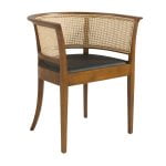 Dining chair upholstered in eco-leather with rattan mesh back. Structure in ash wood painted in walnut colour.