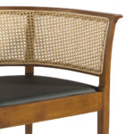 Dining chair upholstered in eco-leather with rattan mesh back. Structure in ash wood painted in walnut colour.