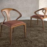 Brown leatherette and walnut chair