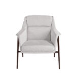 Armchair upholstered in fabric and brown steel legs