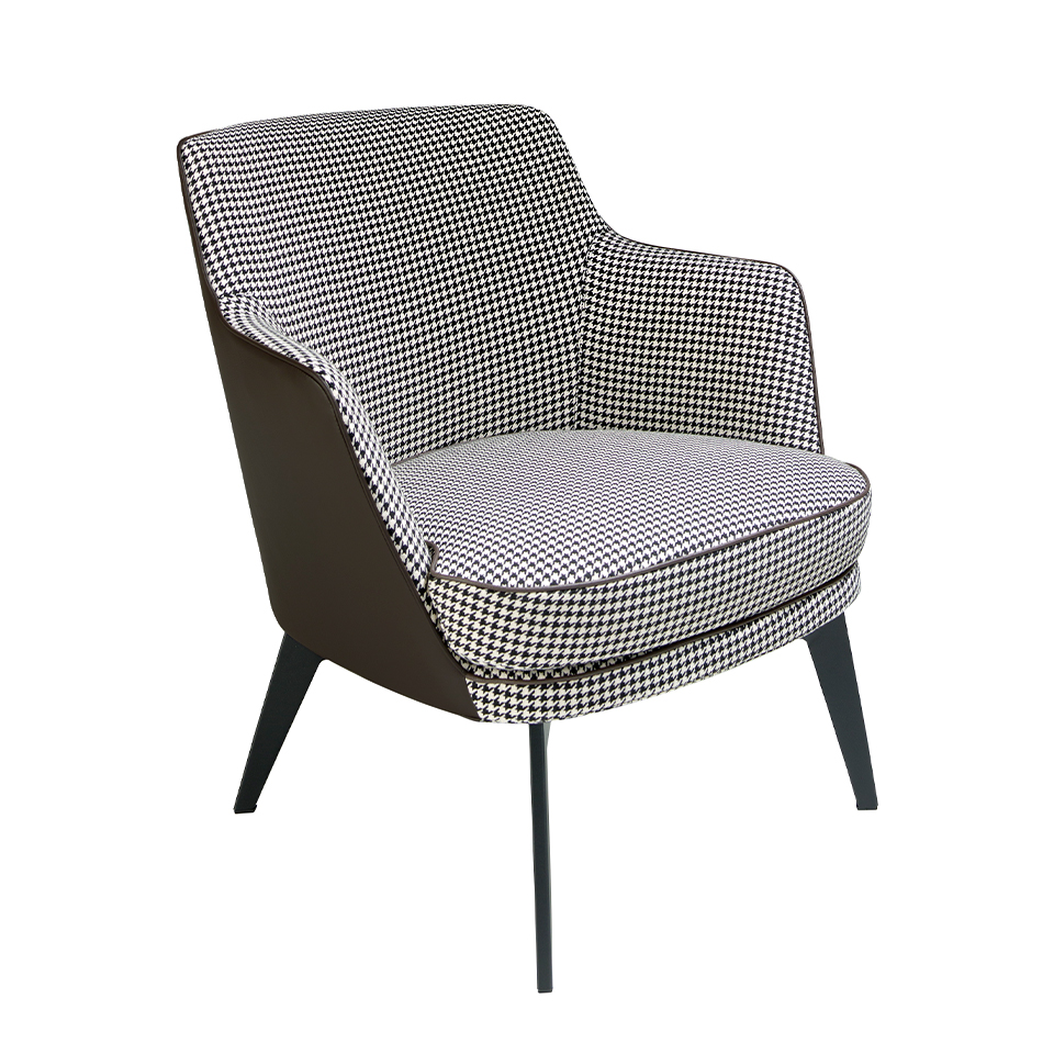 Armchair upholstered in houndstooth fabric