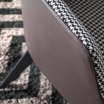 Armchair upholstered in houndstooth fabric