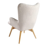 Fauteuil rembourré en tissu capitonné