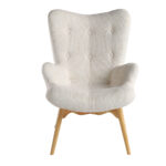 Armchair upholstered in tufted fabric