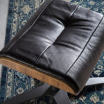Swivel leather upholstered ottoman