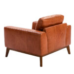 Armchair upholstered in leather and Walnut wood legs