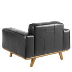 Armchair upholstered in leather and Walnut wood legs