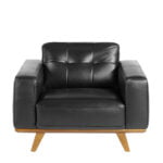 Armchair upholstered in leather and Walnut wood legs