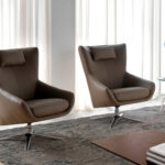 Swivel armchair with leatherette upholstered cushion