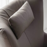 Swivel armchair with leatherette upholstered cushion