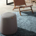 Puff upholstered in gray fabric