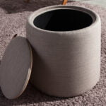 Puff upholstered in gray fabric