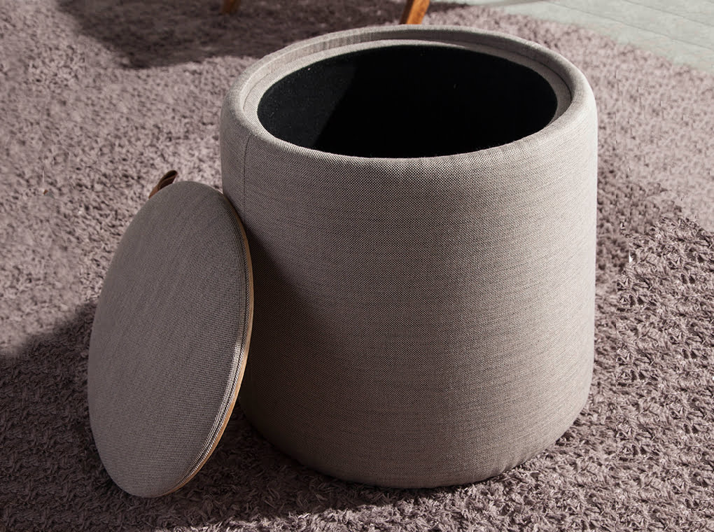 Puff upholstered in gray fabric