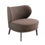 Armchair upholstered in fabric and brown steel legs