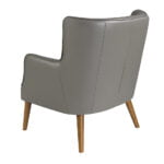 Upholstered leather armchair with capitonné upholstery