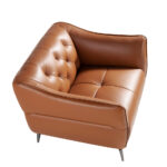 Leather upholstered capitonné armchair