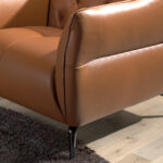 Leather upholstered capitonné armchair