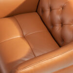 Leather upholstered capitonné armchair